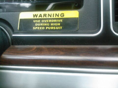 1991 Ford Crown Victoria - A warning sticker on the dashboard reads "Use overdrive during high speed pursuit."