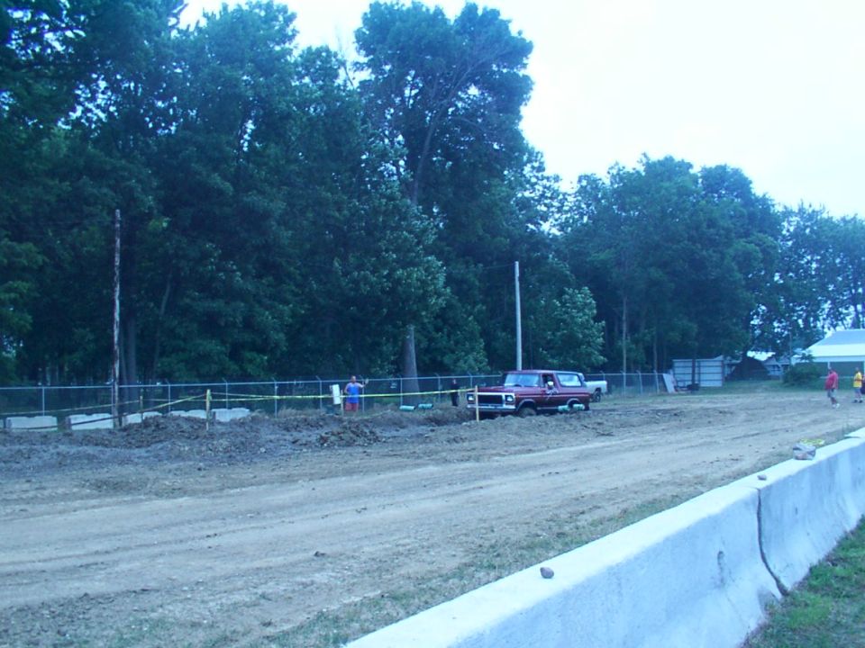 Red 1979 Ford Bronco on a dirt track