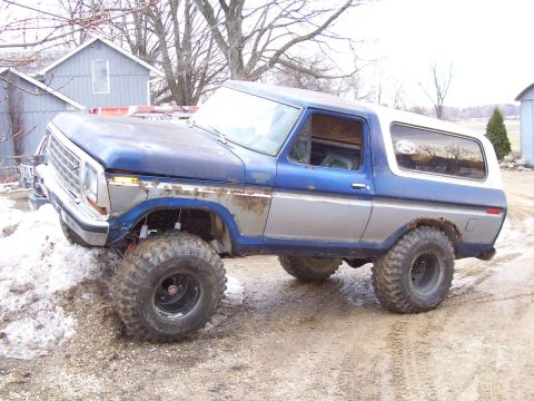 1978 Ford Bronco - This lifted 1978 Ford Bronco features a two-tone blue and silver paint scheme and aggressive off-road tires, suggesting it's built for chal…