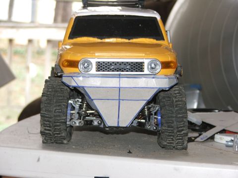 1996 Ford Bronco - A toy FJ Cruiser is shown with a custom-made bumper and large off-road tires.