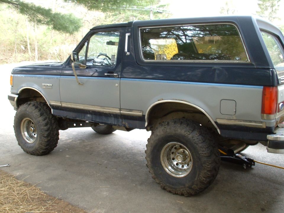 1991 Ford Bronco, two-tone blue and gray, lifted with large tires