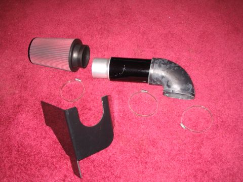 2007 Ford Mustang - This aftermarket cold air intake kit includes a filter, intake tube, elbow, and hose clamps.