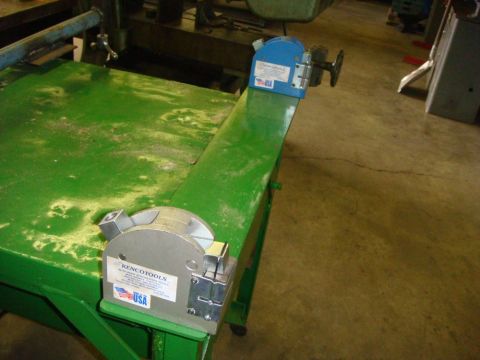 1996 Ford Bronco - Shop tools are mounted on a green workbench in a garage setting.
