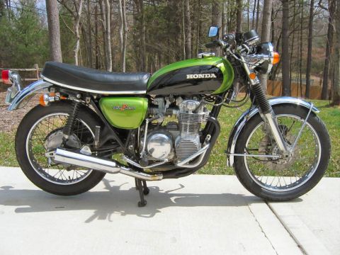 1985 Ford Crown Victoria LTD - 1972 Honda CB500 motorcycle with green and black paint scheme.