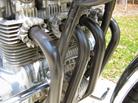 1985 Ford Crown Victoria LTD - Motorcycle engine detail showing exhaust headers and cooling fins.