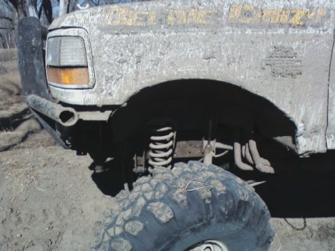 1992 Ford F-350 - This heavily modified 1992 Ford F-350 is covered in mud, indicating it has been used for off-roading.