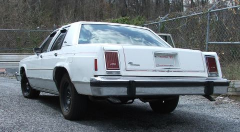 1985 Ford Crown Victoria LTD - Rear view of a white 1985 Ford Crown Victoria LTD, steel wheels and a Virginia license plate.