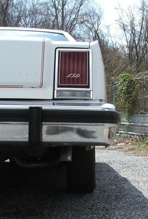 1985 Ford Crown Victoria LTD - Rear view of a 1985 Ford LTD showing the taillight assembly and chrome bumper.