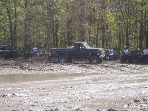 1989 Ford Bronco - Mud bogging event with a lifted Ford pickup truck and several ATVs.