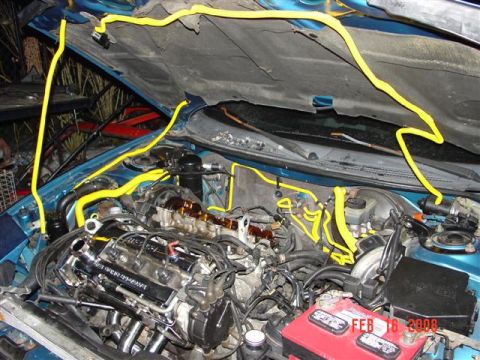 1993 Ford Probe - Engine bay with yellow tubing and a red battery, dated February 16, 2008.