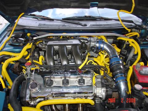 1993 Ford Probe - Engine bay with V6 DOHC 24 valve engine and extensive yellow wiring, dated March 2, 2008.