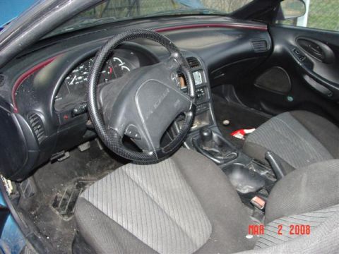 1993 Ford Probe - Interior view of a 1993 Ford Probe, highlighting the dashboard and seating areas.