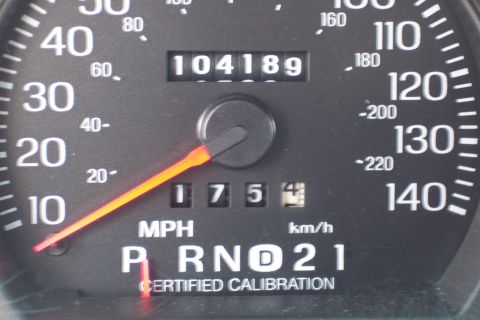 2001 Ford Crown Victoria - Car's odometer shows 104,189 miles with a trip meter reading 1754. Certified calibration noted.