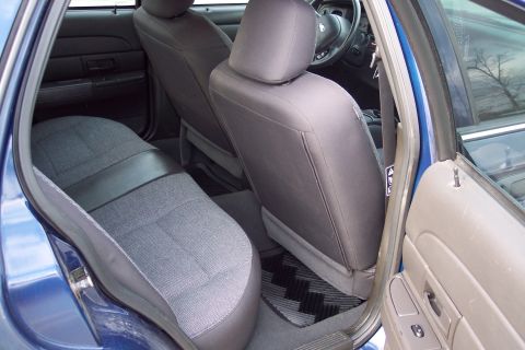 2001 Ford Crown Victoria - Interior view of a 2001 Ford Crown Victoria, highlighting the seating and door panel details.