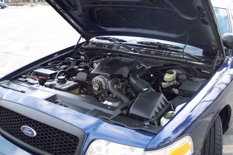2001 Ford Crown Victoria - Engine bay of a 2001 Ford Crown Victoria, hood is open, revealing the V8 engine.