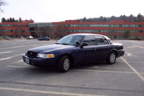 2001 Ford Crown Victoria - 2001 Ford Crown Victoria sedan parked in a lot.