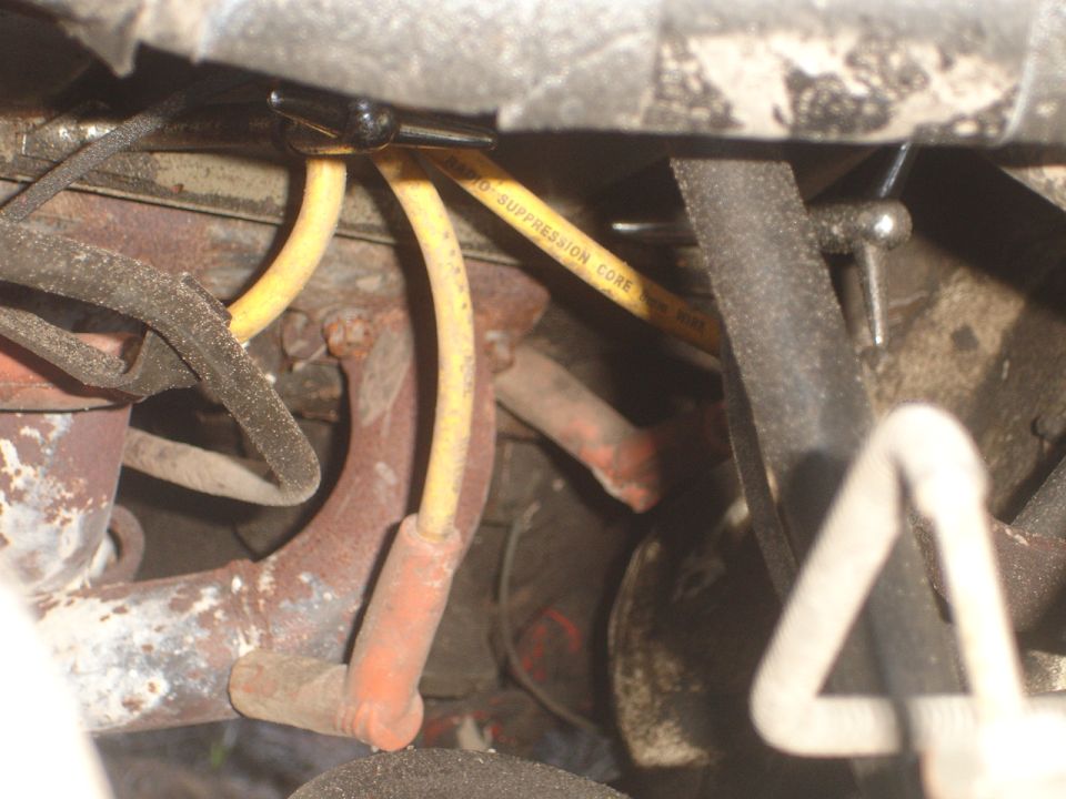 Yellow spark plug wire with "RADIO SUPPRESSION CORE" text