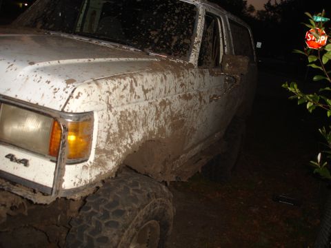 1989 Ford Bronco - This 1989 Ford Bronco is heavily caked in mud, obscuring much of its white paintwork.