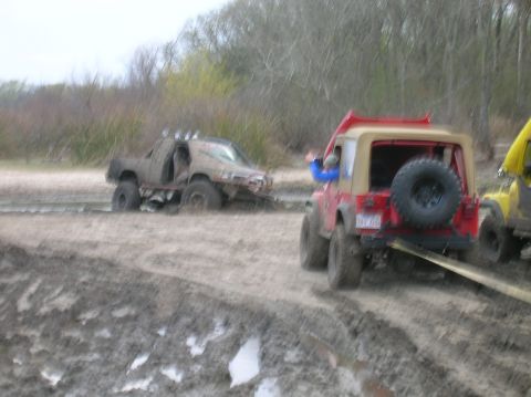 1996 Ford Bronco - Off-road vehicles struggle in deep mud near Marlin City Lake, Marlin, TX.