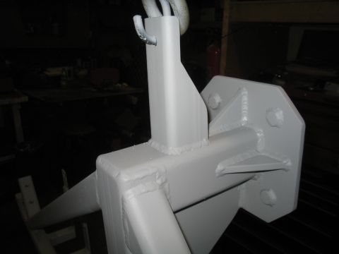 1989 Ford Bronco - Close-up view of a painted metal component, possibly a hitch or bracket, with visible welds and a hook mechanism.