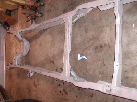 1991 Ford Bronco - A vehicle frame, likely from a truck or SUV, is shown after being painted.