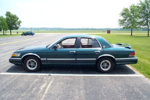1993 Mercury Grand Marquis - With the spoiler, the factory wheels didn't cut it. Thankfully I had a set of Torque Thursts laying around.