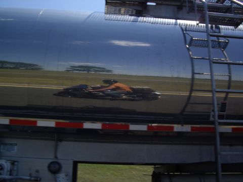 2005 BMW R1200CA ABS - A reflection shows a person riding a motorcycle on the side of a large tanker truck.