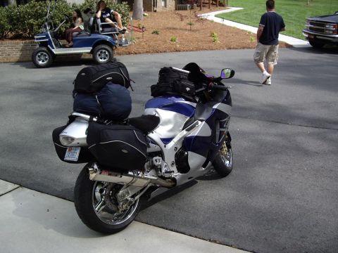 2005 BMW R1200CA ABS - A motorcycle is parked on a paved surface, equipped with multiple bags for travel.