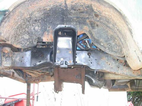 1990 Ford Bronco - Driver's side coil bucket, note that I couldn't use the lower front hole in the bucket, so I drilled another one.
