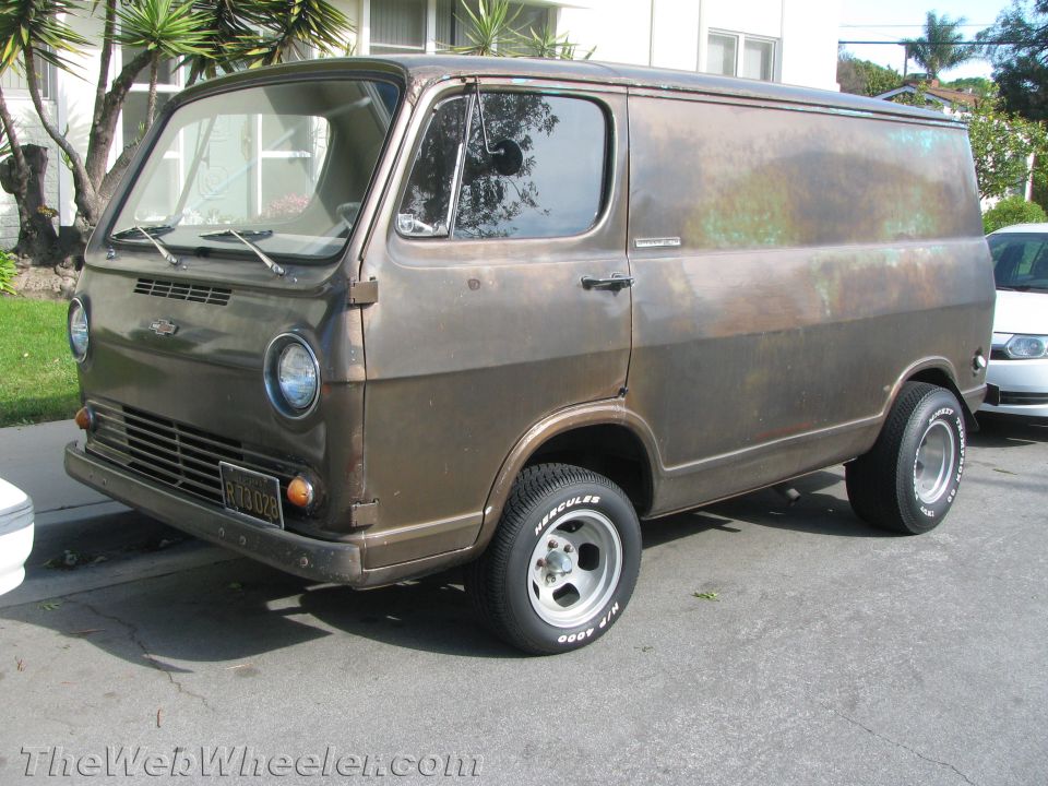 Brown panel van with custom wheels and tires, license plate RBU 028