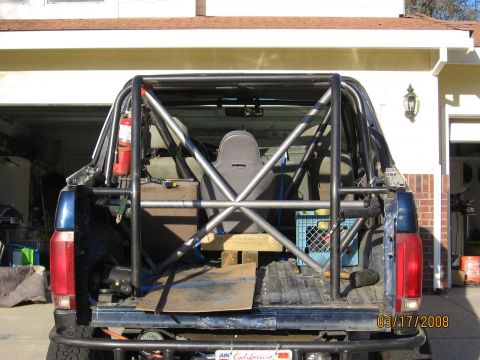 1994 Ford Bronco - Rear view of a 1994 Ford Bronco modified with a custom roll cage and racing seat.