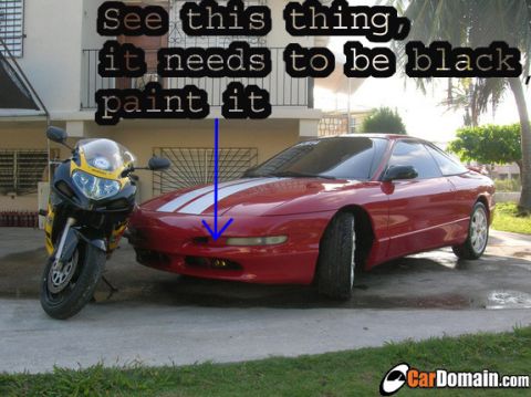 1993 Ford Probe - A red 1993 Ford Probe coupe is parked next to a motorcycle, with text overlay suggesting a paint job.