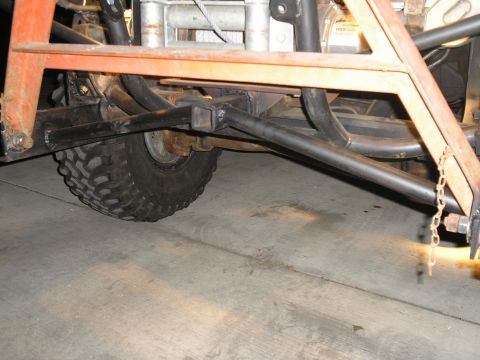 1990 Ford Bronco - Custom tow hitch fabrication visible on vehicle frame, including suspension and tire detail.