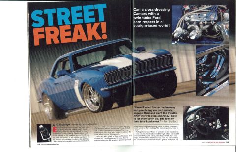 2005 Ford Mustang - This modified 1967 muscle car, featured in a magazine spread, showcases its aggressive styling and custom modifications.