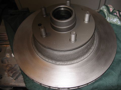 1968 Shelby GT500 - A close-up view of a front brake rotor and hub assembly, showing the five wheel studs.
