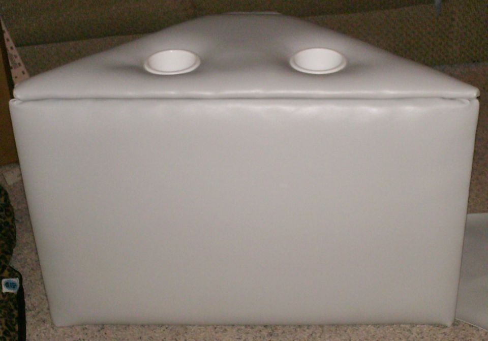 White upholstered box with two circular openings on top