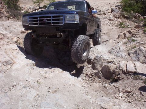 1992 Ford F-150 - This 1992 Ford F-150 navigates a challenging rocky trail, its off-road capabilities.