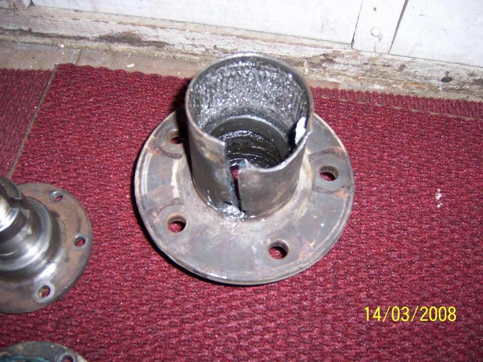 damaged wheel hub assembly with a split metal sleeve