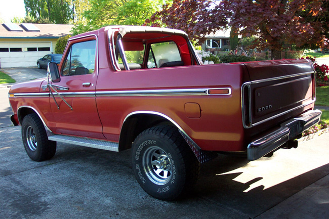 Red 1978 Ford Bronco parked on a driveway