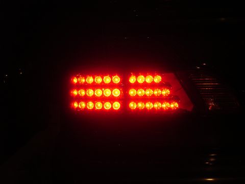 1993 Ford Taurus - Illuminated red LED tail light assembly, likely a replacement part.