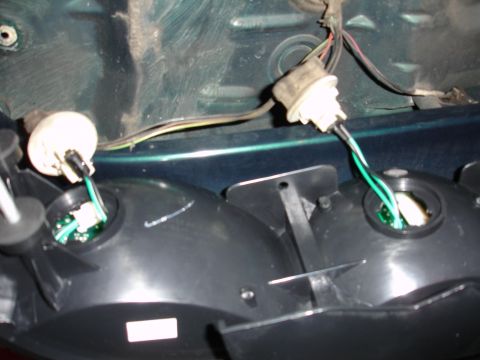 1993 Ford Taurus - Close-up of a vehicle's taillight assembly, revealing its internal components and wiring.