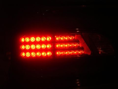 1993 Ford Taurus - Close-up of a red LED tail light assembly, likely an aftermarket part.