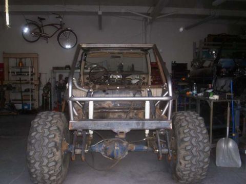 1982 Toyota 4Runner - This vehicle is being worked on in a garage, with a bicycle hanging on the wall.