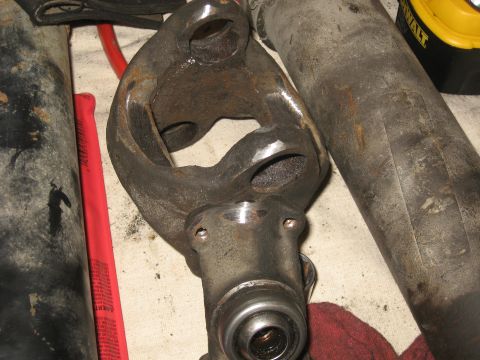 1990 Ford F-250 - A close-up view of a driveshaft universal joint, a critical component for vehicle power transmission.