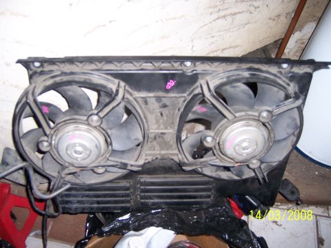1991 Ford Bronco - Assembly of dual electric radiator fans, likely for a vehicle cooling system.