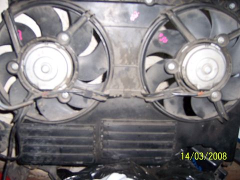 1991 Ford Bronco - Close-up view of two electric cooling fans mounted together on a black housing.