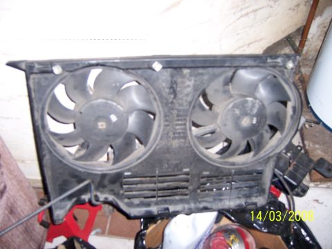 1991 Ford Bronco - A pair of electric cooling fans are shown mounted in a black shroud.