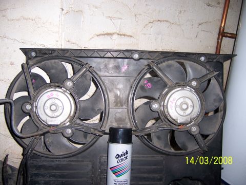 1991 Ford Bronco - A pair of electric cooling fans are shown, with a can of spray paint placed in front of them.