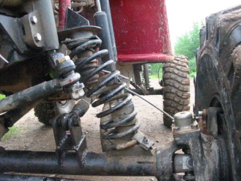 1979 Ford F-250 - Close-up view of off-road vehicle suspension and tires.