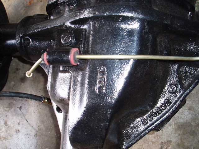 I split a vacum hose and placed it around the brake line and then split a heater hose line to go over that to secure them tightly. This sould also keep the line from rubbing any holes in it.